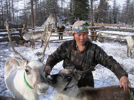 Dukha woman with her reindeer