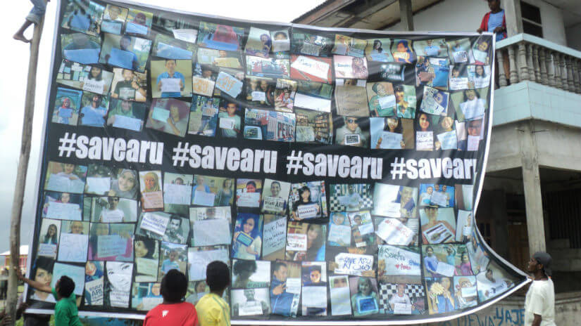 A banner made of solidarity messages sent from around the world on social media is displayed in Dobo