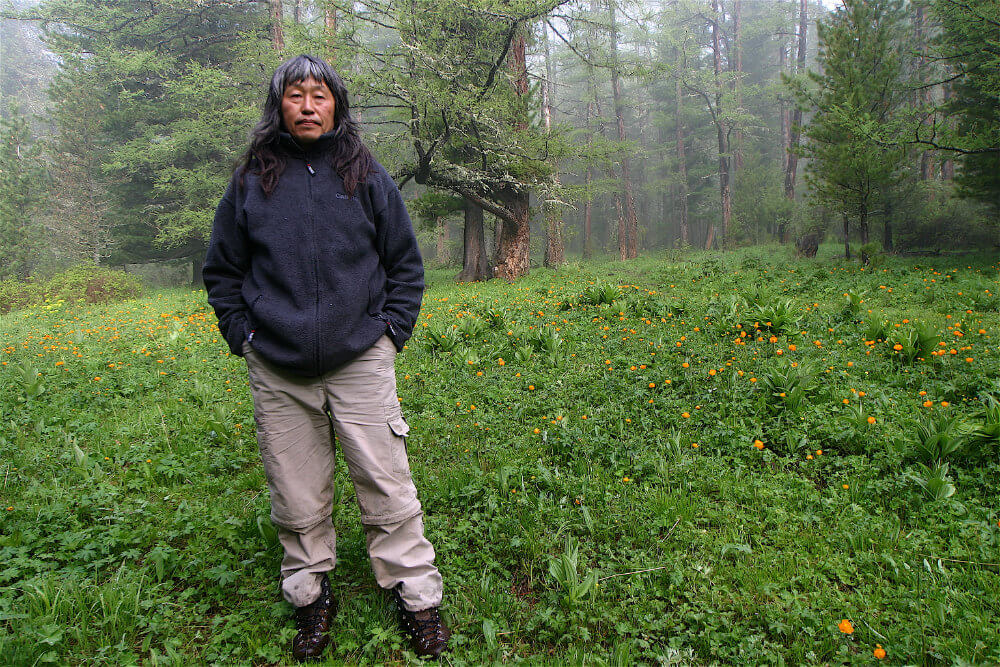 Danil on pilgrimage at the sacred Uch Enmek Mountain (Photo: Toby McLeod)