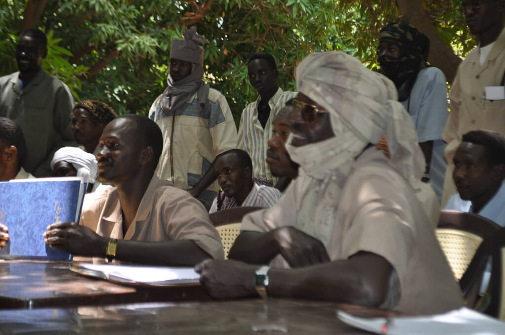 Former JEM leader Khalil Ibrahim sits on the right (deceased), in Ain Siro, North Darfur, Sept 12, 2009. (Photo by the US  State Department)
