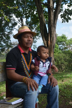 Feliciano Valencia with the baby who he had been separated from for 54 days while held in a maximum security prison. Robin Llewellyn 