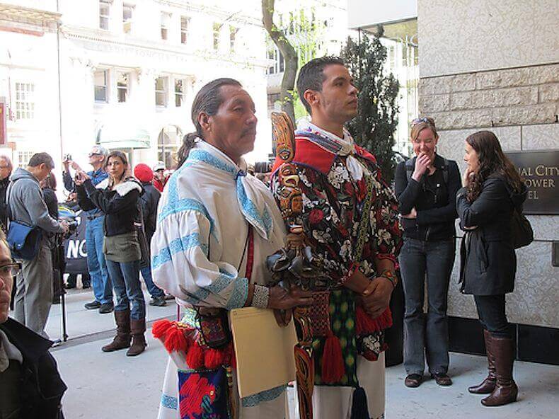 Jesús Lara Chivarra and Cilau Valadez face the entrance to First Majestic Silver Corp. headquarters in Vancouver, demanding entrance to the annual stockholders meeting. 