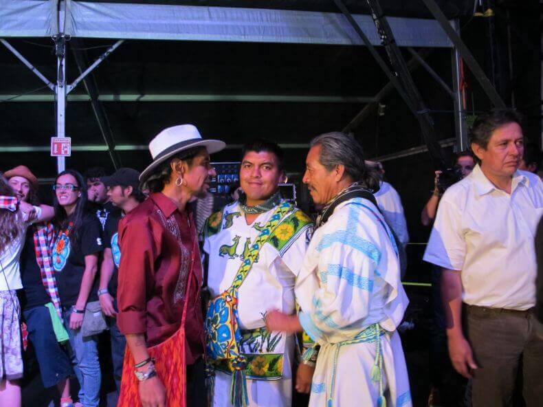 Jesus Lara Chivarra and Santos de la Cruz visit with Roco of the rock group Maldita Vecindad after Wirikuta Fest, which drew more than 60,000 fans and raised millions of pesos for the cause.