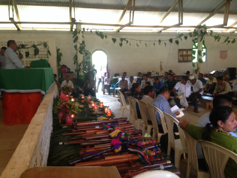 Dozens of staff lay on the table showing that many ancestral authorities are attending the general assembly in Copones. Photo: Manuela Picq