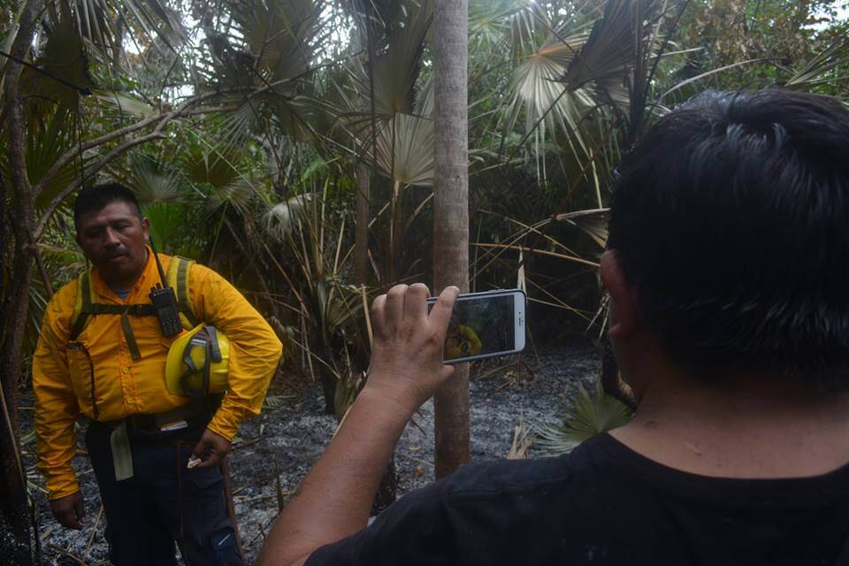 Pedro Canché interviewing a fireman