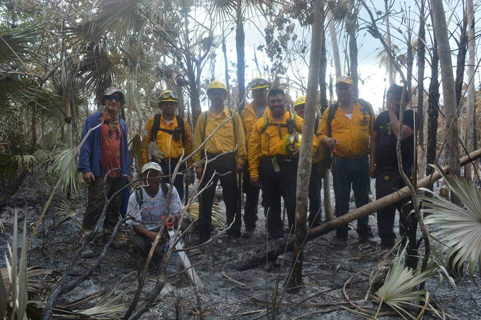 Pedro Canché with the firemen