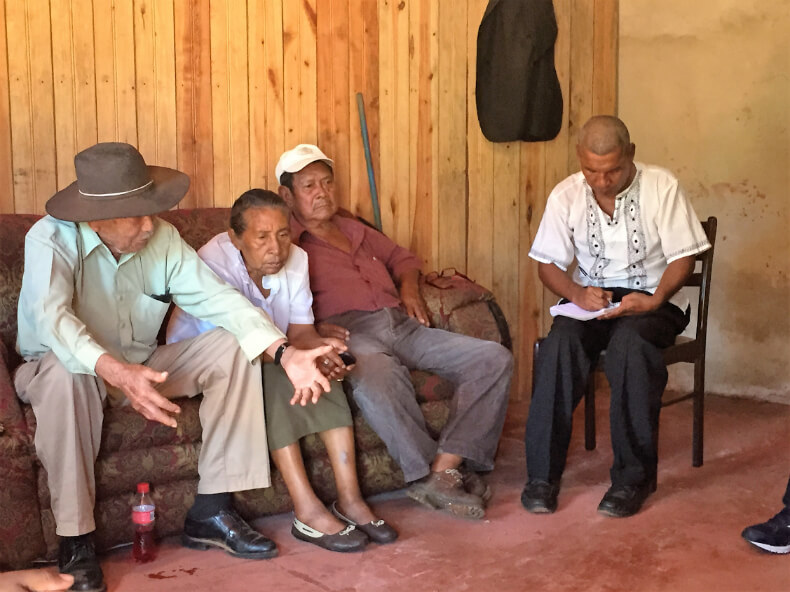 Members of the Miskitu Council of Elders, and secretary Rosman Flores, gather in Bilwi to discuss their list of demands from the YATAMA political party in a private meeting preceding the YATAMA conference in February of 2016. Photo by Courtney Parker.