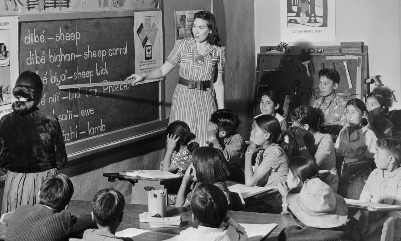 Teacher Pointing to Blackboard in Navajo School
