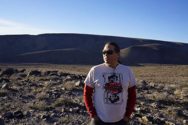 standing at the base of Yucca Mountain 